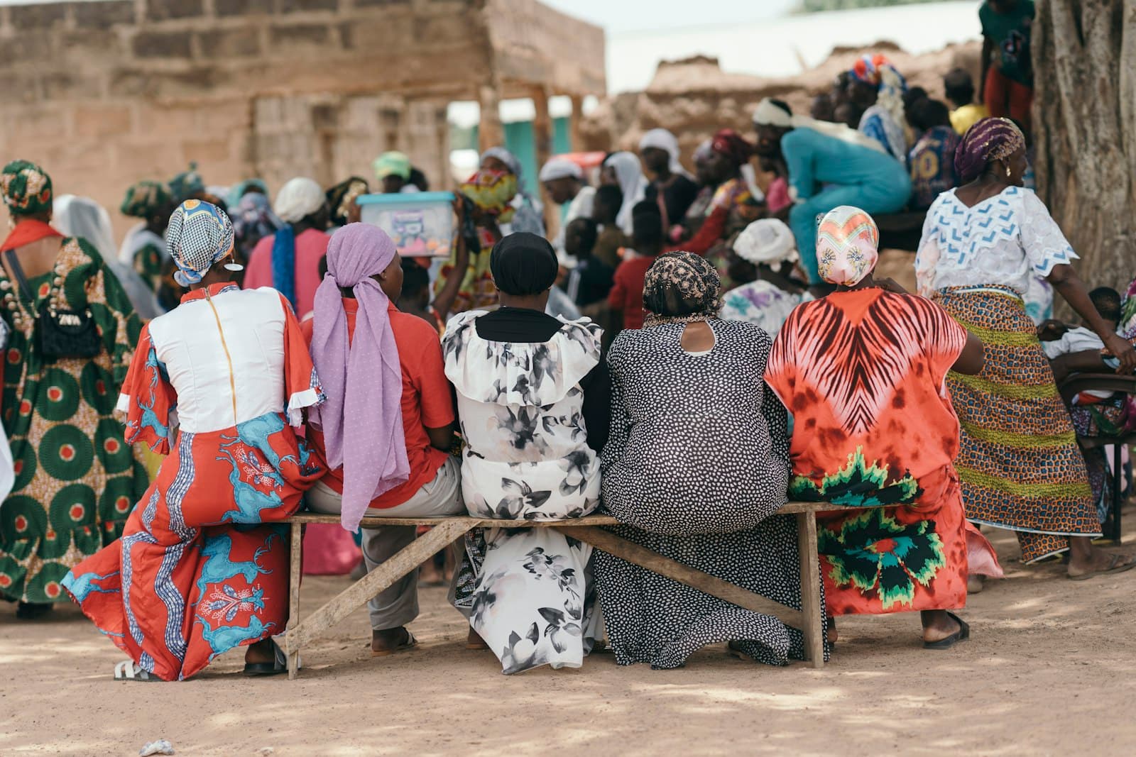 A group of women sitting together in their community